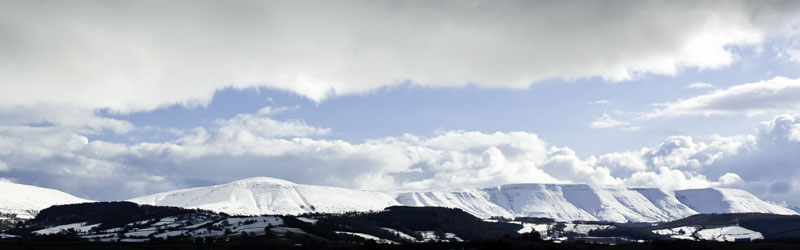 Black Mountains with brecon beacons in snow during winter from westview guesthouse B&B Hay-on-wye